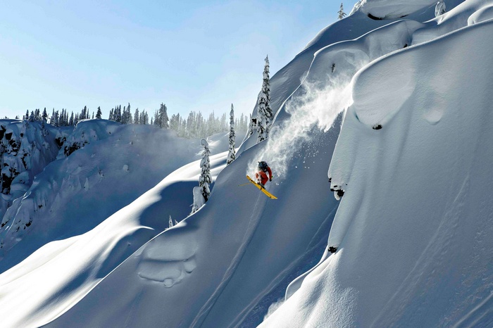 Skiing down a snowy mountain in Alaska