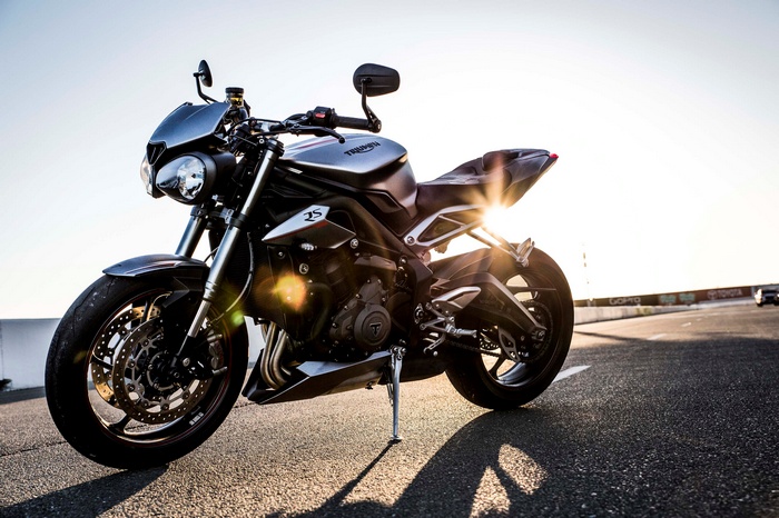 Triumph Street Triple RS motorcycle at sunset