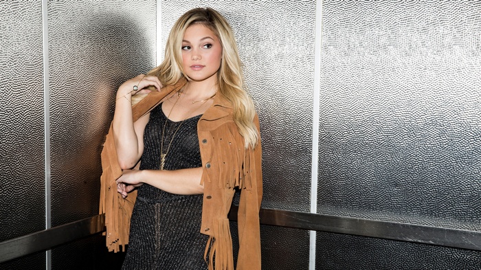 Olivia Holt in a Fringed Jacket