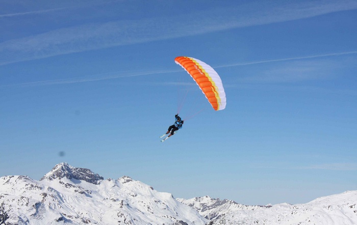 Speed Riding with Paraglider over Snowy Mountains 4K