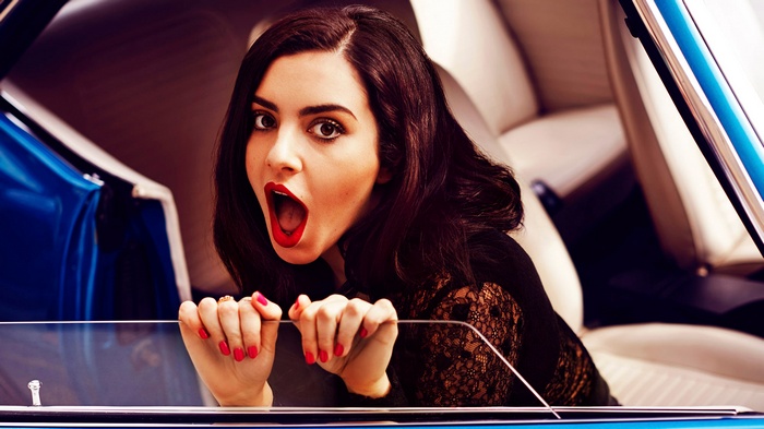 Charli XCX in a blue car