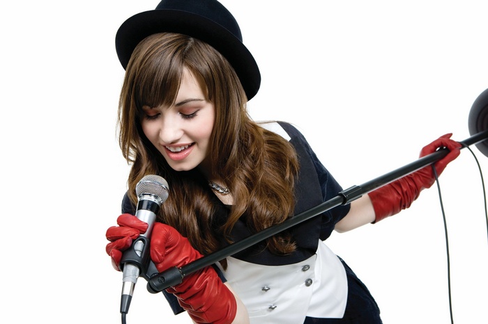 Demi Lovato singing with a microphone