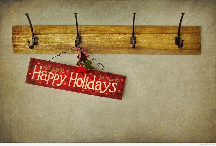 Happy Holidays sign on a coat rack