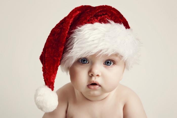 Baby wearing a Santa hat