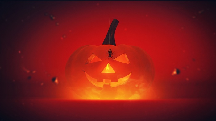 Halloween pumpkin with a spider hanging