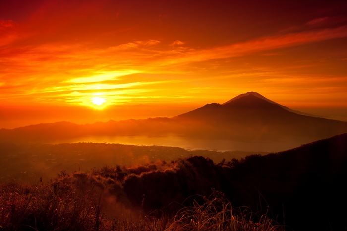 Sunrise over mountains and lake
