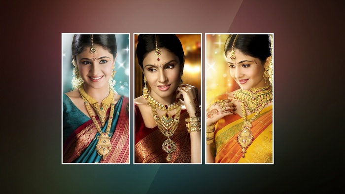 Three Indian women adorned with traditional gold jewelry