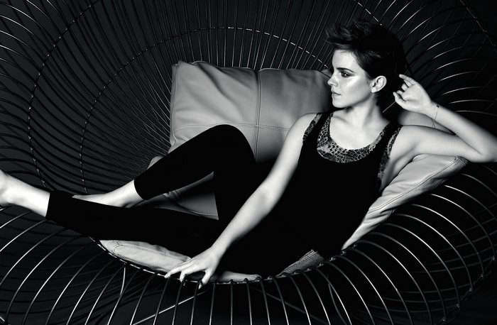 Emma Watson in a black tank top and leggings