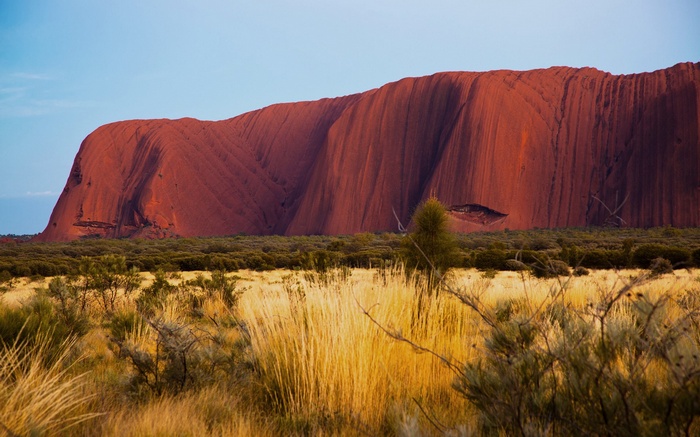 Uluru rock formation in the Australian Outback at sunset