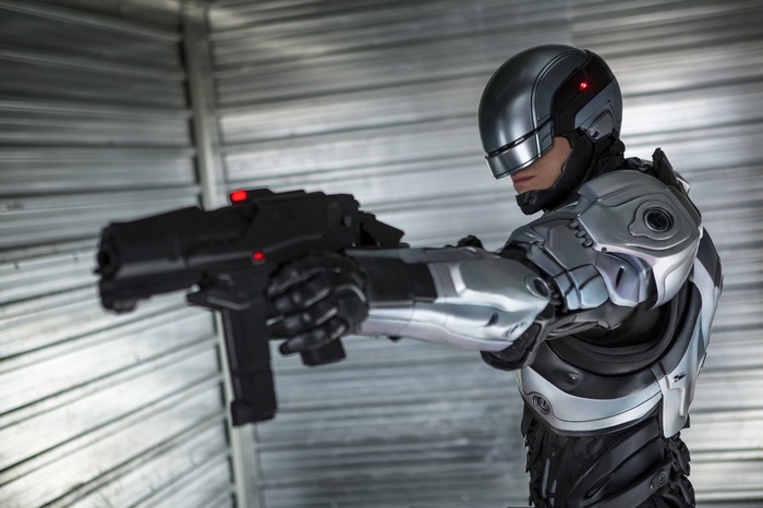 RoboCop holding a gun