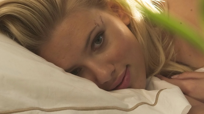 Scarlett Johansson lying on a pillow