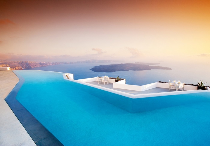 Infinity pool overlooking the sea in Santorini, Greece