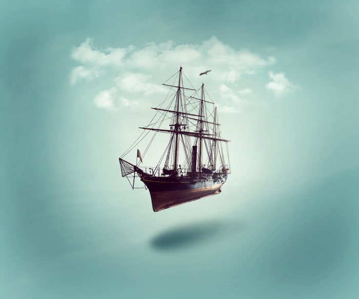 A sailing ship floats in the sky