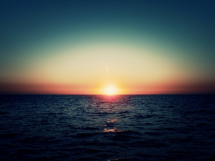 Sunset over the ocean horizon