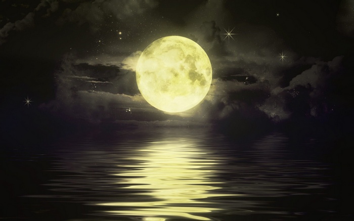 Full moon reflecting on water at night