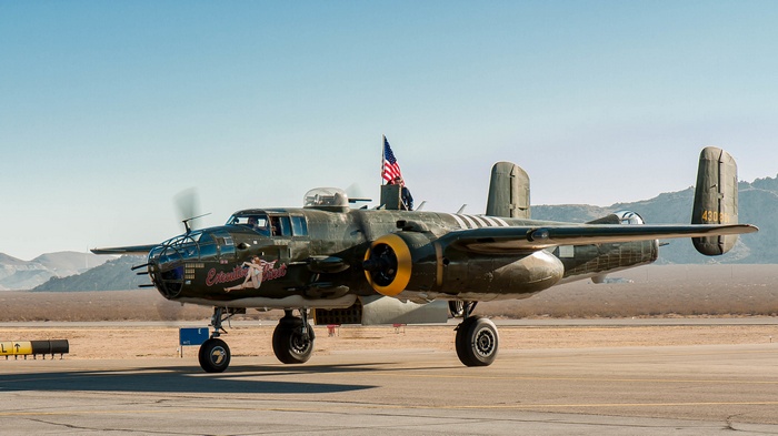 North American B-25 Mitchell bomber with American flag