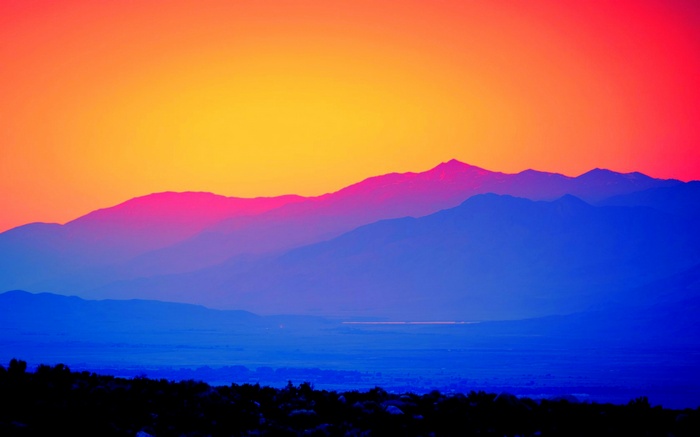 Mountains at dawn with vibrant sky