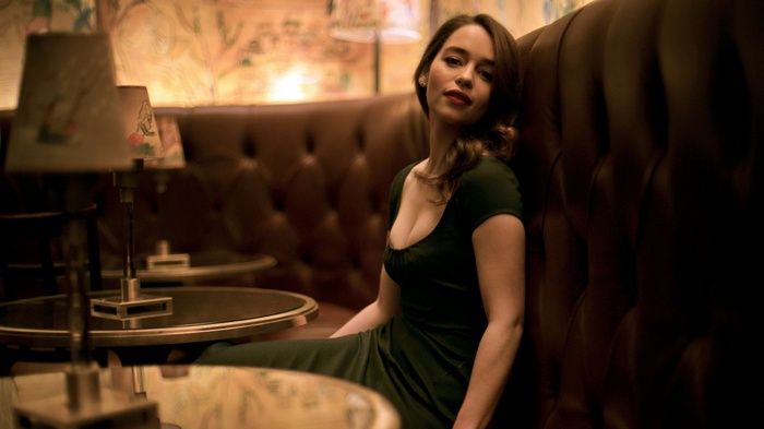 Emilia Clarke sitting in a booth