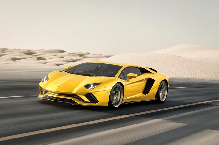 Yellow Lamborghini Aventador S driving on a desert road