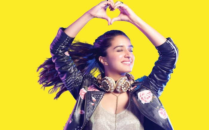 Shraddha Kapoor with headphones making heart shape