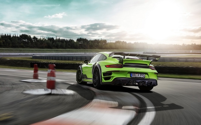 Green Porsche 911 Turbo GTstreet R on a race track