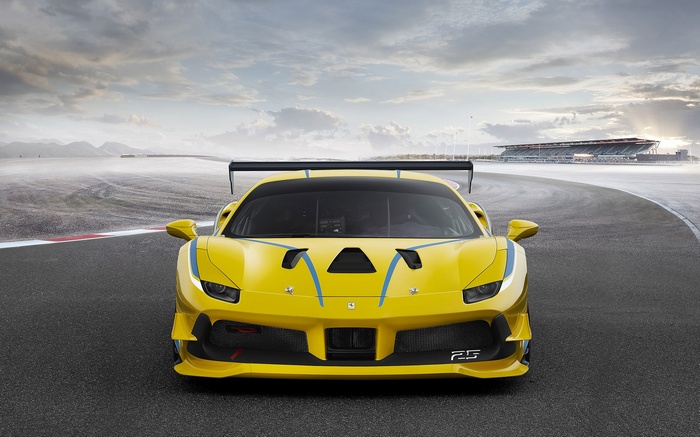 Yellow Ferrari 488 Challenge on a Race Track