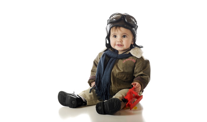 Baby in Pilot Outfit with Toy Plane