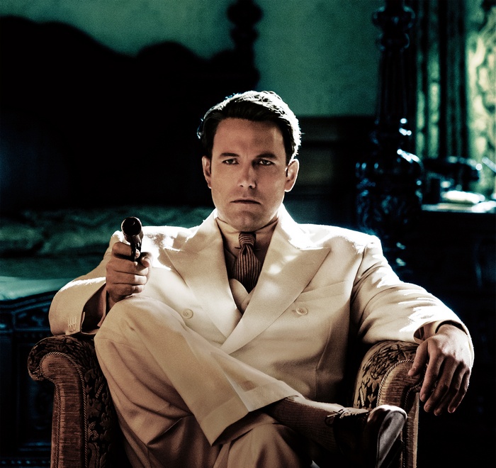 Joe Coughlin from Live by Night holding a gun