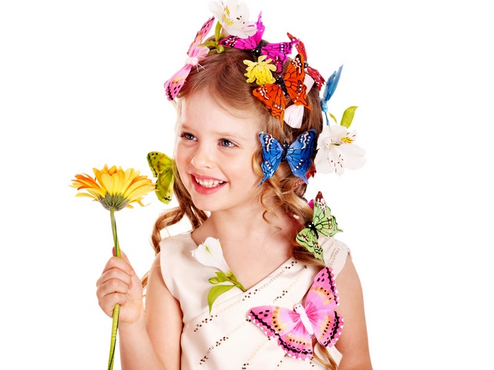 Girl with flowers and butterflies in her hair