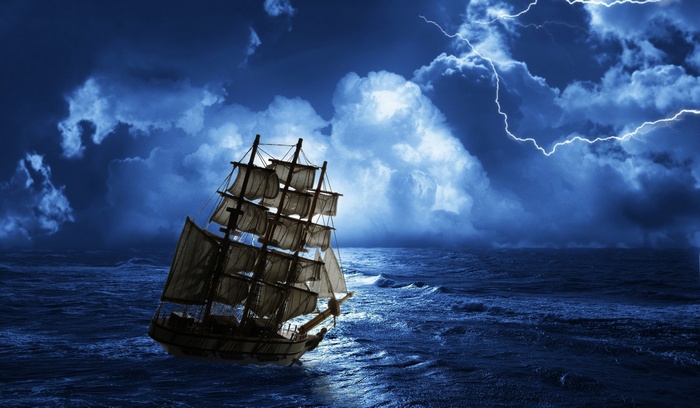 Sailing ship in a sea storm with lightning