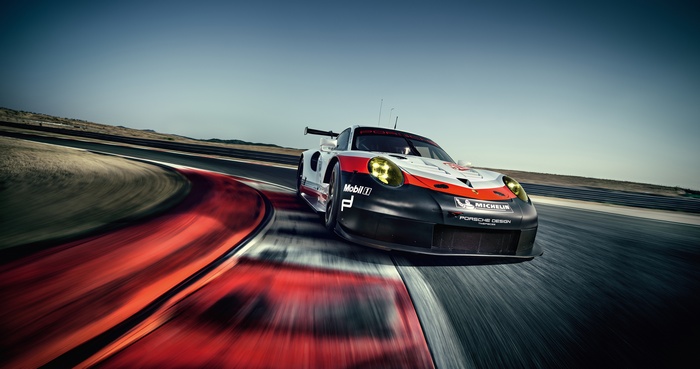 Porsche 911 RSR racing on a track