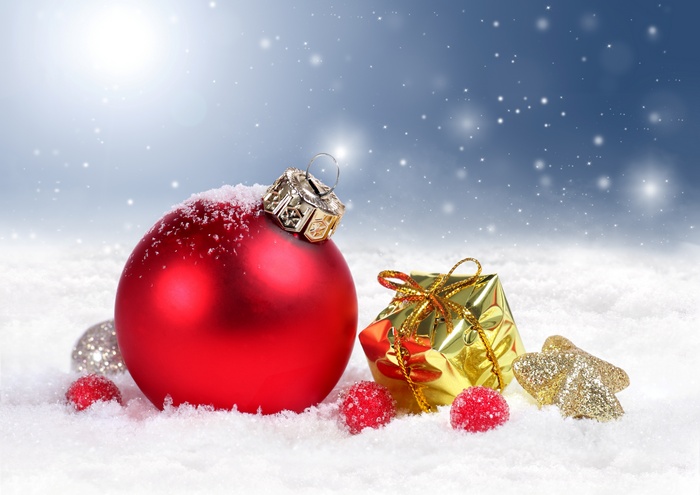 Christmas ornaments and gifts in snow
