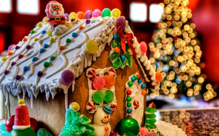 Christmas gingerbread house with Santa and Christmas tree