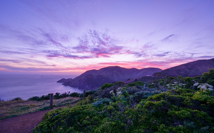 Purple Sunset Over Coastal Mountains and Ocean