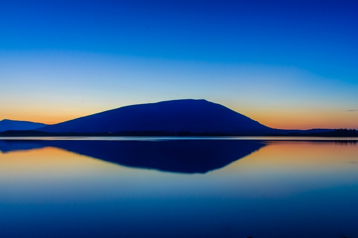Mountain reflection on a lake at dusk