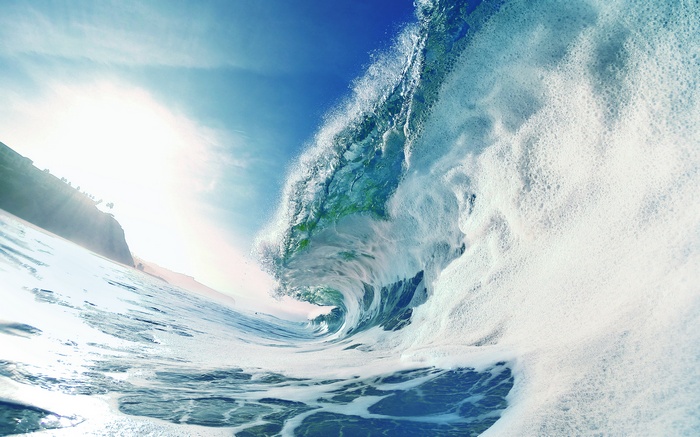 Ocean wave crashing on a sunny day