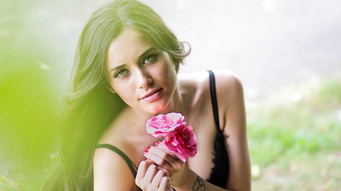 Woman holding pink roses