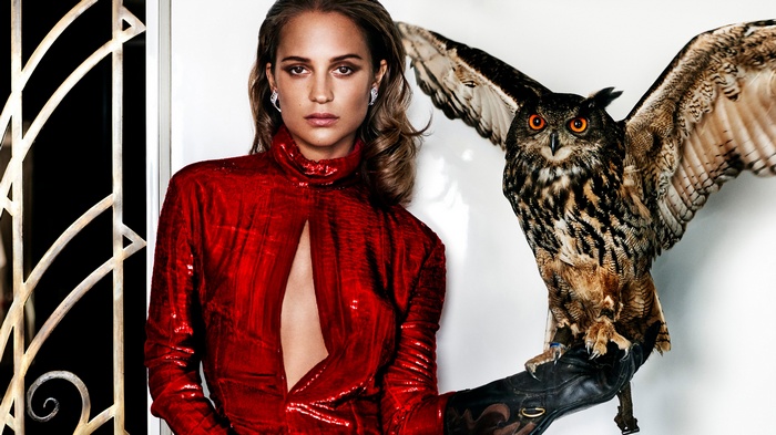 Alicia Vikander with an owl for Vanity Fair