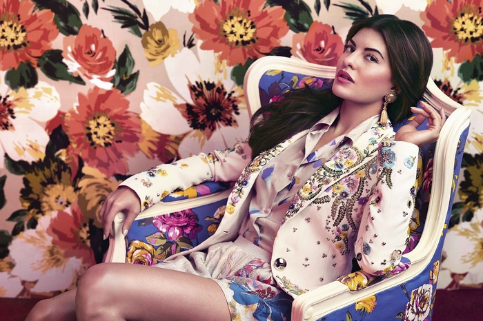 Jacqueline Fernandez sitting in a floral chair