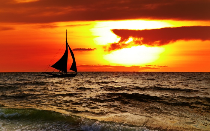 Sailboat silhouette at sunset