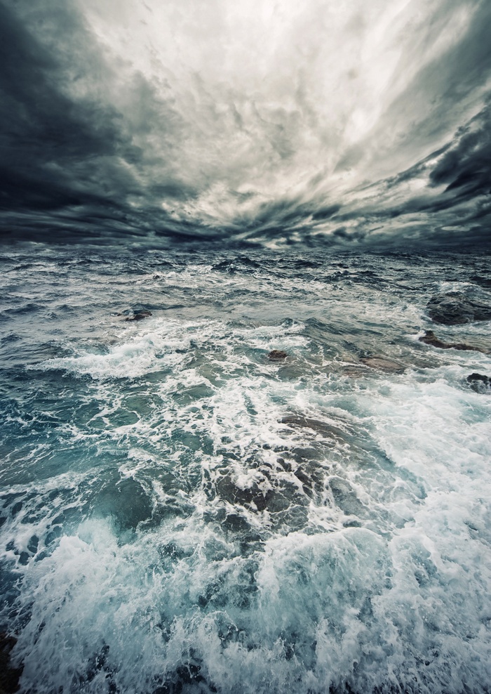 Stormy ocean with dark clouds and waves