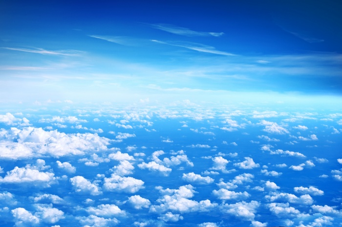 Blue sky with clouds from above
