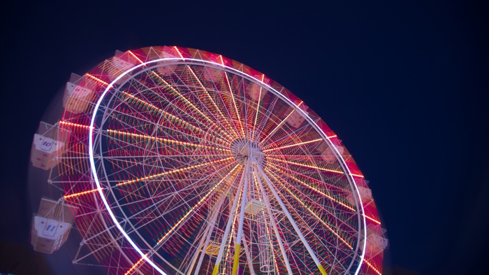 Ferris wheel at night with colorful lights