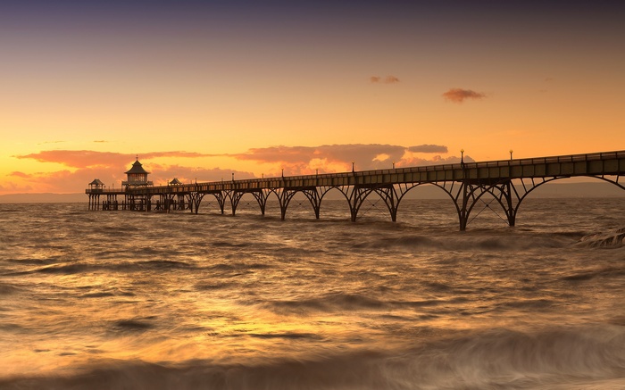 Pier over the sea at sunset