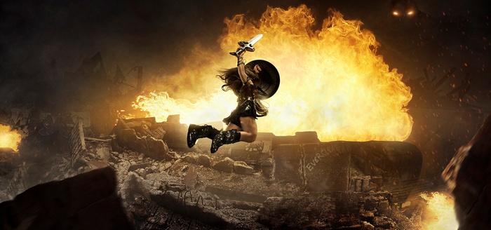 Wonder Woman in a battle scene with fire