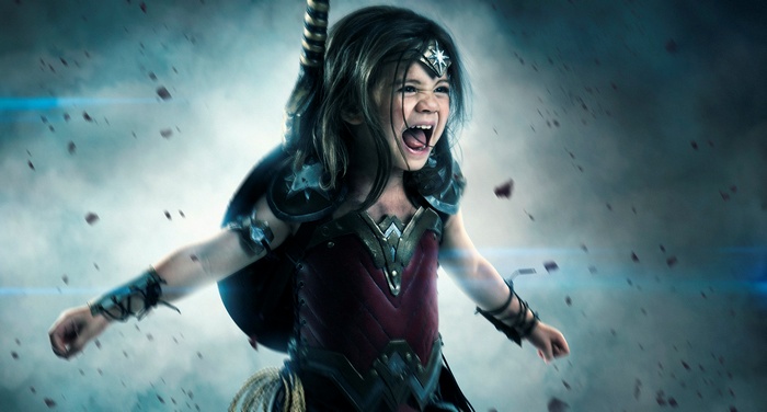 Young girl dressed as Wonder Woman in battle