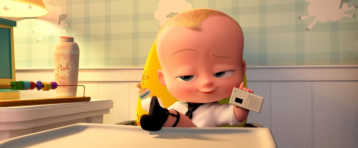 The Boss Baby holding a device