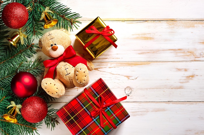 Teddy bear with Christmas decorations and presents