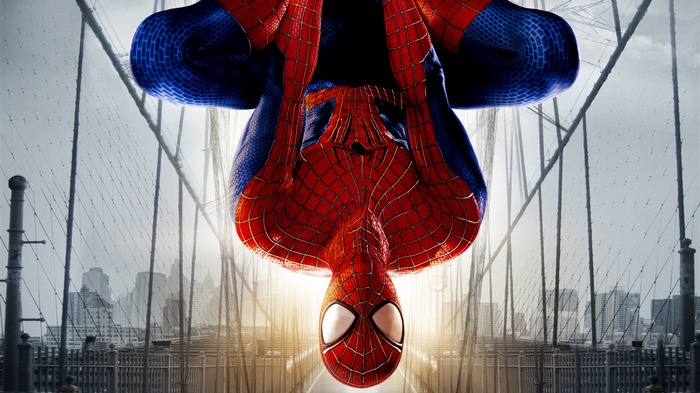 The Amazing Spider-Man hanging upside down on a bridge