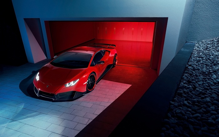 Red Lamborghini Huracan RWD parked in a modern garage